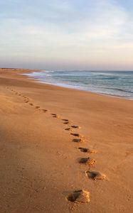 Preview wallpaper sand, footprints, coast, sea