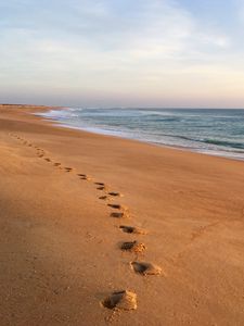 Preview wallpaper sand, footprints, coast, sea