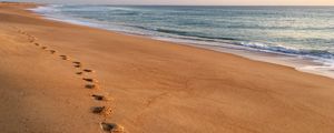 Preview wallpaper sand, footprints, coast, sea