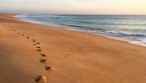 Preview wallpaper sand, footprints, coast, sea