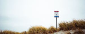 Preview wallpaper sand, grass, sign, hill