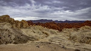 Preview wallpaper sand, mountains, stones, clouds, dark, nature