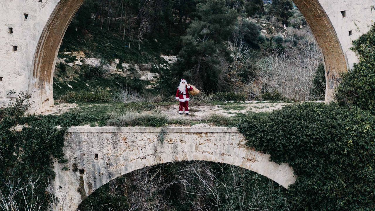 Wallpaper santa claus, bridge, arch, costume, bag, cliff, trees, bushes