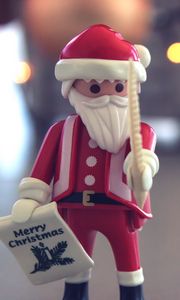 Preview wallpaper santa claus, christmas, toy, blur, glare