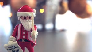 Preview wallpaper santa claus, christmas, toy, blur, glare