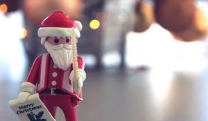 Preview wallpaper santa claus, christmas, toy, blur, glare