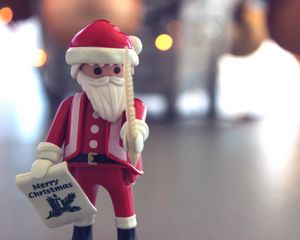 Preview wallpaper santa claus, christmas, toy, blur, glare