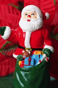 Preview wallpaper santa claus, christmas, toy, sack, flowers