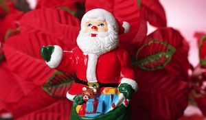 Preview wallpaper santa claus, christmas, toy, sack, flowers