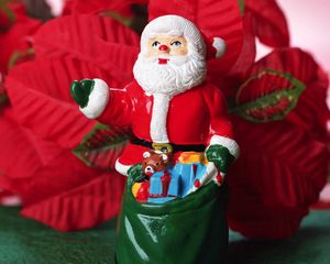 Preview wallpaper santa claus, christmas, toy, sack, flowers