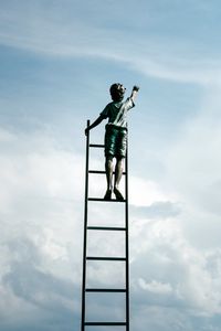 Preview wallpaper sculpture, boy, ladder, clouds, sky