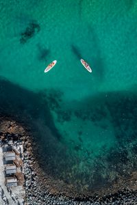 Preview wallpaper sea, aerial view, boats, water, coast, stony