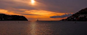 Preview wallpaper sea, bay, lighthouse, mountains, sunset, clouds, sun