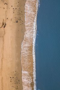 Preview wallpaper sea, beach, aerial view, wave, surf, sand