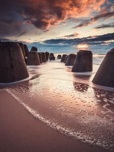 Preview wallpaper sea, beach, breakwaters, water, sand, sunset