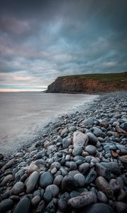 Preview wallpaper sea, beach, cliff, pebble, landscape