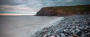 Preview wallpaper sea, beach, cliff, pebble, landscape