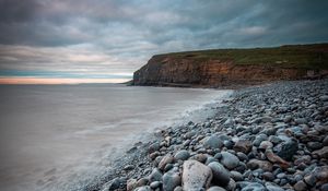 Preview wallpaper sea, beach, cliff, pebble, landscape