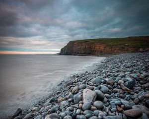 Preview wallpaper sea, beach, cliff, pebble, landscape
