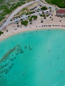 Preview wallpaper sea, beach, coast, tropics, road, cars, top view