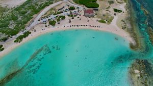 Preview wallpaper sea, beach, coast, tropics, road, cars, top view