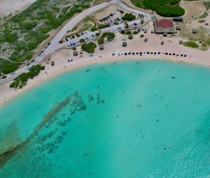 Preview wallpaper sea, beach, coast, tropics, road, cars, top view