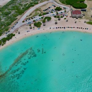 Preview wallpaper sea, beach, coast, tropics, road, cars, top view