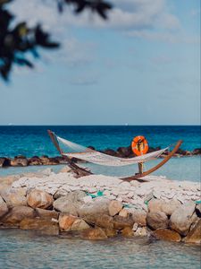 Preview wallpaper sea, beach, hammock, stones, summer, holiday