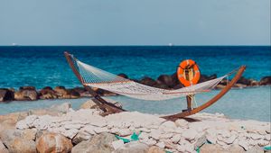 Preview wallpaper sea, beach, hammock, stones, summer, holiday