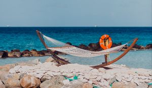 Preview wallpaper sea, beach, hammock, stones, summer, holiday