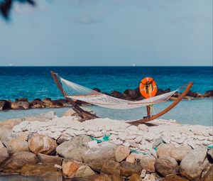 Preview wallpaper sea, beach, hammock, stones, summer, holiday