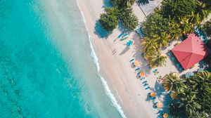 Preview wallpaper sea, beach, palm trees, umbrellas, summer, aerial view