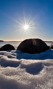 Preview wallpaper sea, beach, rocks, snow, light