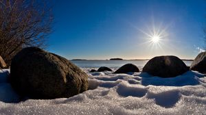 Preview wallpaper sea, beach, rocks, snow, light