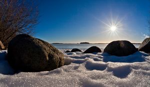 Preview wallpaper sea, beach, rocks, snow, light