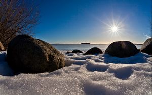 Preview wallpaper sea, beach, rocks, snow, light