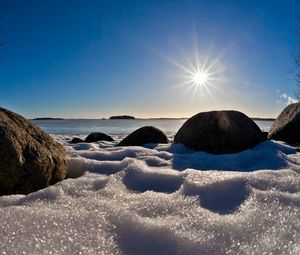 Preview wallpaper sea, beach, rocks, snow, light