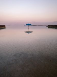 Preview wallpaper sea, beach, umbrella, water, reflection
