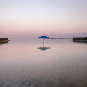 Preview wallpaper sea, beach, umbrella, water, reflection