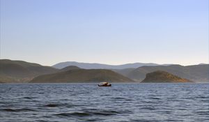 Preview wallpaper sea, boat, water, island, hills