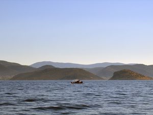 Preview wallpaper sea, boat, water, island, hills