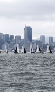 Preview wallpaper sea, boats, sails, skyscrapers, city