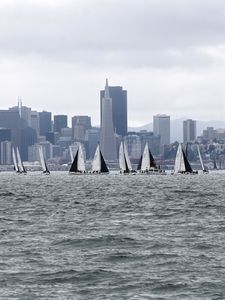 Preview wallpaper sea, boats, sails, skyscrapers, city