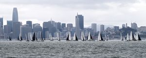Preview wallpaper sea, boats, sails, skyscrapers, city