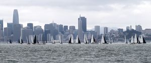 Preview wallpaper sea, boats, sails, skyscrapers, city