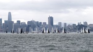 Preview wallpaper sea, boats, sails, skyscrapers, city