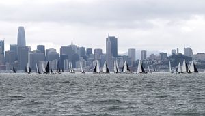 Preview wallpaper sea, boats, sails, skyscrapers, city