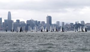Preview wallpaper sea, boats, sails, skyscrapers, city