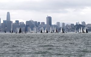 Preview wallpaper sea, boats, sails, skyscrapers, city