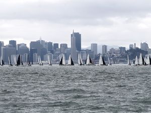 Preview wallpaper sea, boats, sails, skyscrapers, city
